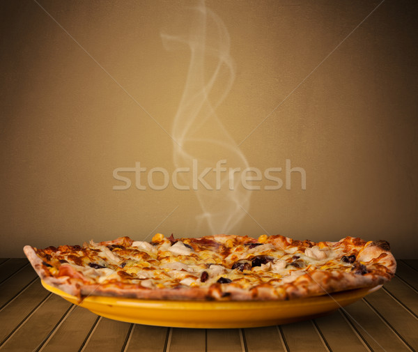 Fresh delicious home cooked pizza with steam Stock photo © ra2studio