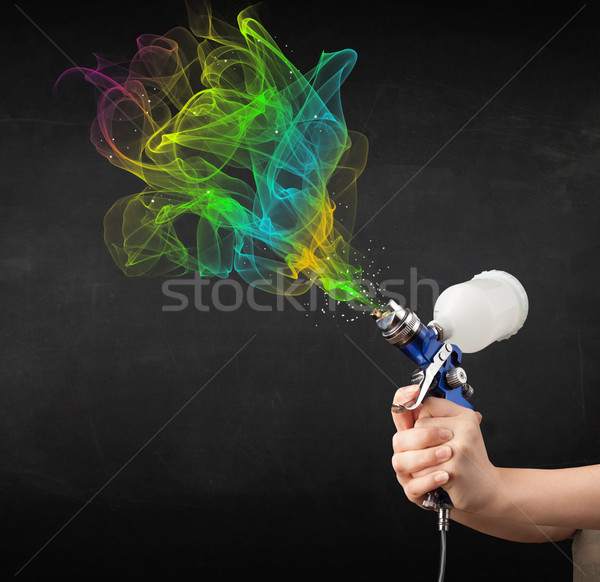 Painter working with airbrush and paints colorful paint Stock photo © ra2studio