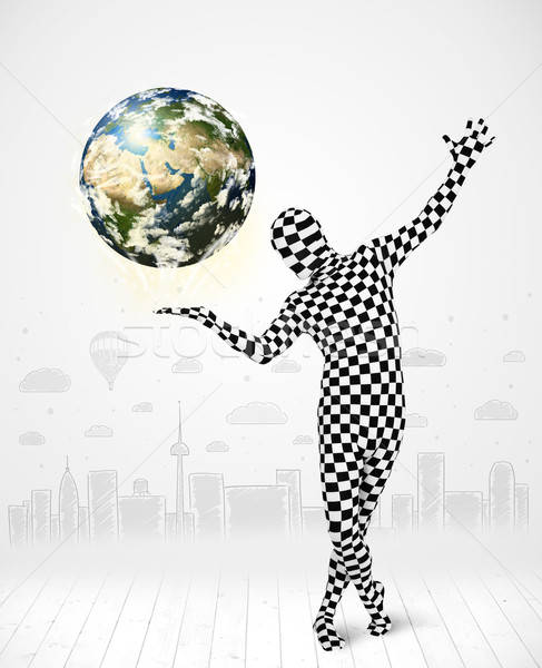 man in full body suit holding planet earth Stock photo © ra2studio