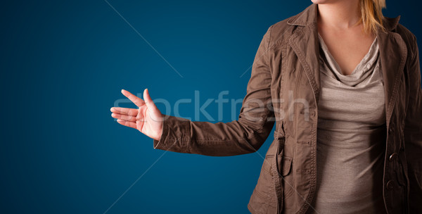 Stock photo: Woman pressing imaginary button