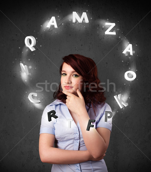 Young woman thinking with letter circulation around her head Stock photo © ra2studio