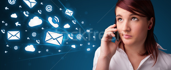 Young lady making phone call with message icons Stock photo © ra2studio