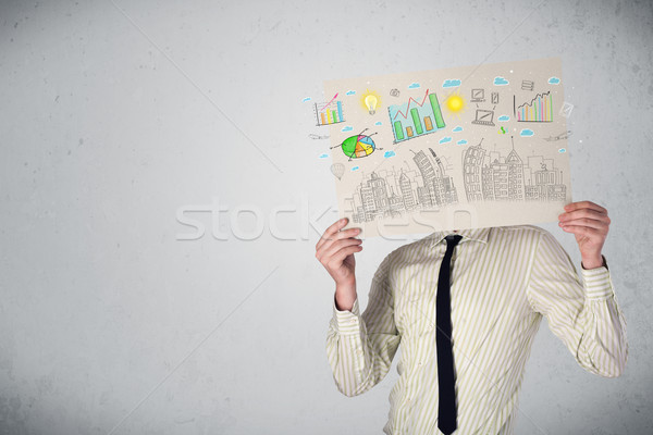 Businessman holding a paper with charts and cityscape in front o Stock photo © ra2studio