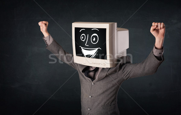 Happy businessman with a PC monitor head and a smiley face Stock photo © ra2studio