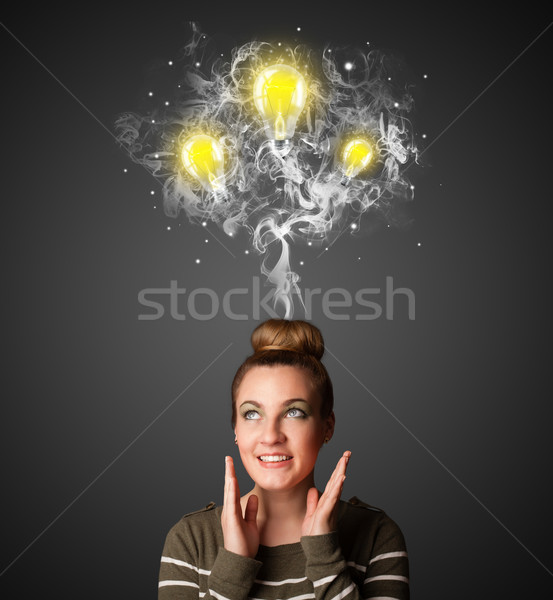 Stock photo: Thoughtful woman with smoke and lightbulbs above her head