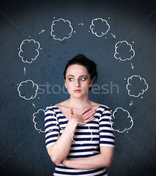 Young woman thinking with cloud circulation around her head Stock photo © ra2studio