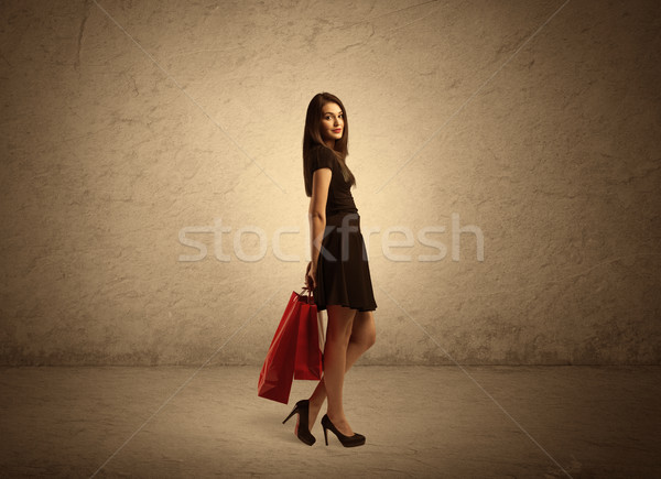 Shopping girl with bags and clear background Stock photo © ra2studio
