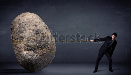 üzletember húz hatalmas kő kötél férfi Stock fotó © ra2studio