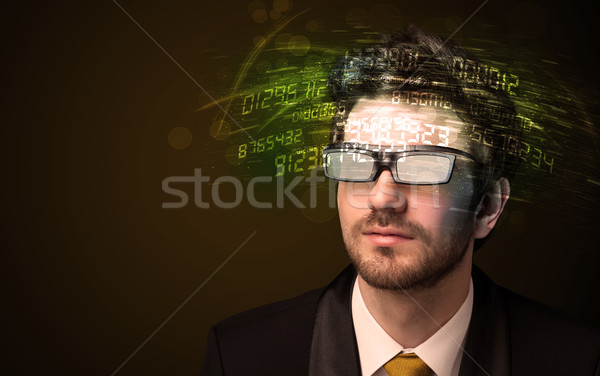 Człowiek biznesu patrząc wysoki tech numer komputera Zdjęcia stock © ra2studio