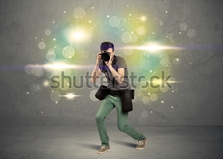 Photographer with flashing lights Stock photo © ra2studio