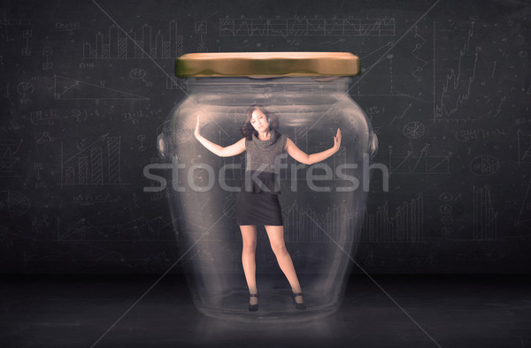 Stock photo: Businesswoman shut inside a glass jar concept