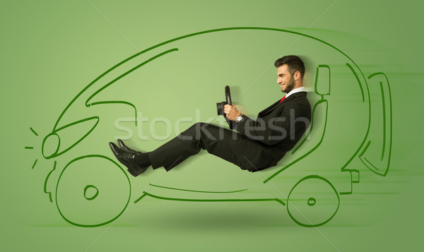 Man drives an eco friendy electric hand drawn car  Stock photo © ra2studio