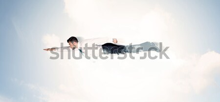 Zdjęcia stock: Człowiek · biznesu · pływające · jak · superhero · chmury · niebo