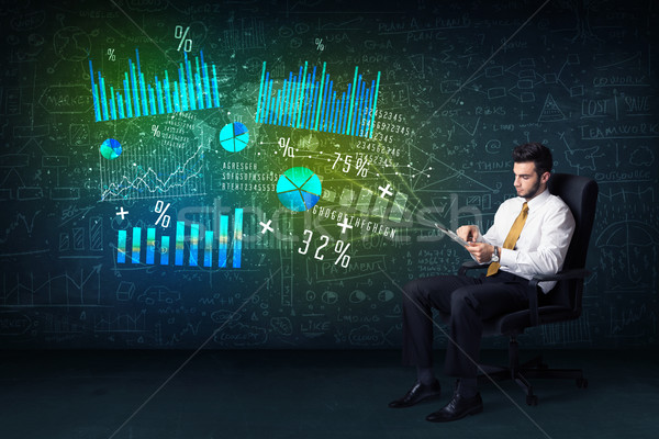 Businessman in office chair with tablet in hand and high tech gr Stock photo © ra2studio