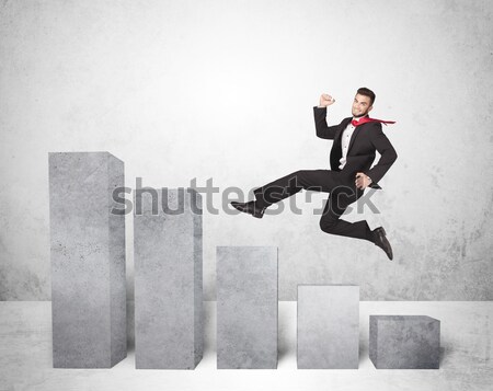 Energetic business man jumping over a bridge with gap Stock photo © ra2studio