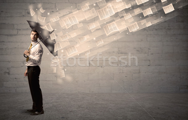 Człowiek biznesu parasol wiatr kart pracy deszcz Zdjęcia stock © ra2studio