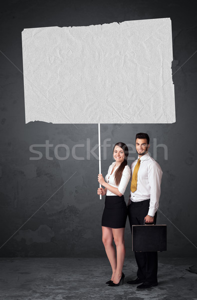 Business couple with blank booklet paper Stock photo © ra2studio