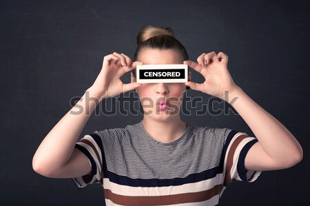 Pretty girl with censored paper sign Stock photo © ra2studio
