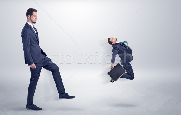 Small man fired by boss with white wallpaper Stock photo © ra2studio