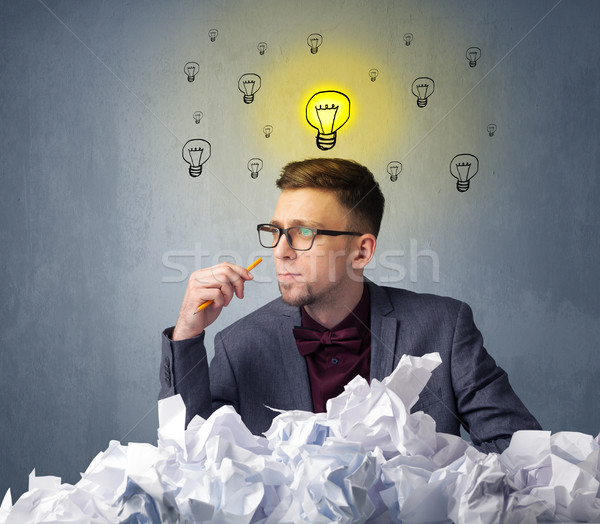 Stock photo: Businessman behind crumpled paper