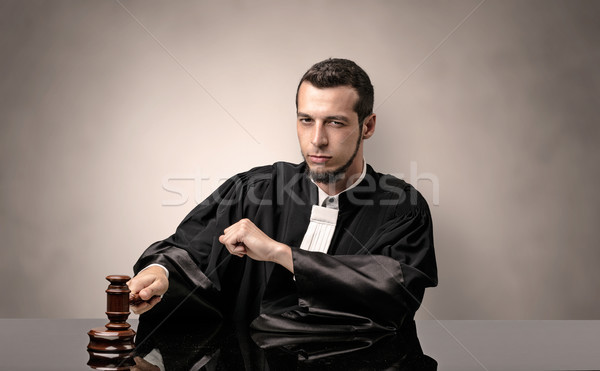 Jovem juiz vestido preto decisão Foto stock © ra2studio