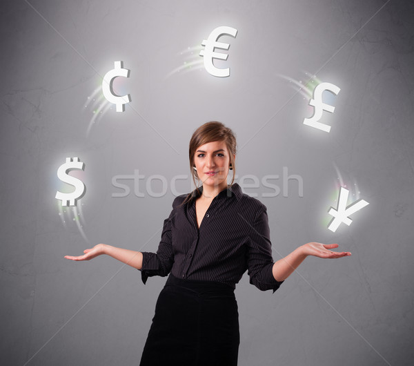  young lady standing and juggling with currency icons Stock photo © ra2studio