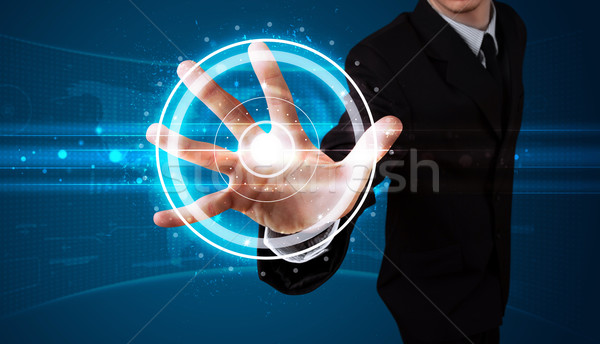 Businessman pressing high tech type of modern buttons  Stock photo © ra2studio