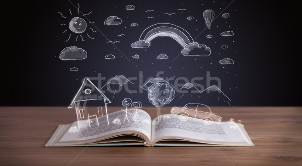 Stock photo: Open book with hand drawn landscape 