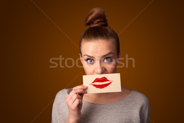 Heureux jolie femme carte baiser rouge à lèvres [[stock_photo]] © ra2studio