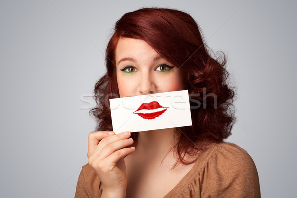 Heureux jolie femme carte baiser rouge à lèvres [[stock_photo]] © ra2studio