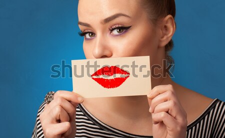 Heureux jolie femme carte baiser rouge à lèvres [[stock_photo]] © ra2studio