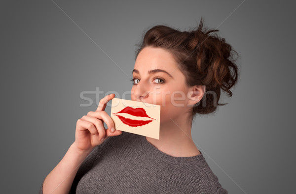 Heureux jolie femme carte baiser rouge à lèvres [[stock_photo]] © ra2studio