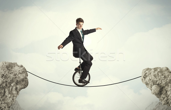 Braver homme d'affaires équitation cycle affaires [[stock_photo]] © ra2studio