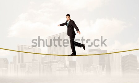 Energikus üzletember ugrik híd hézag férfi Stock fotó © ra2studio