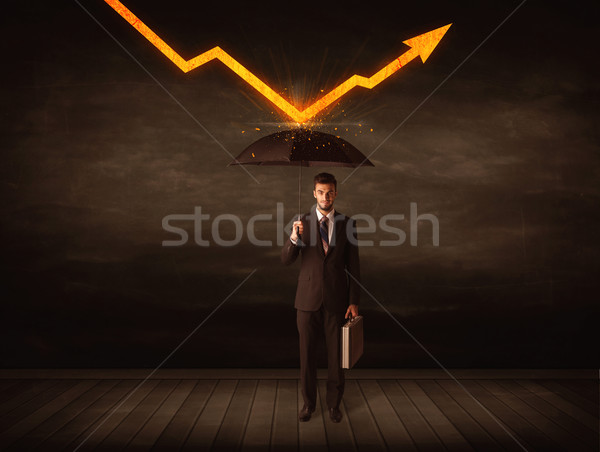 Businessman standing with umbrella keeping orange arrow  Stock photo © ra2studio