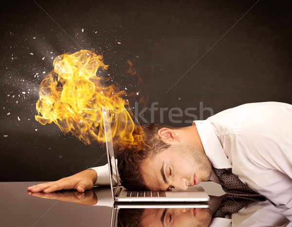Stressed business man's head is burning Stock photo © ra2studio