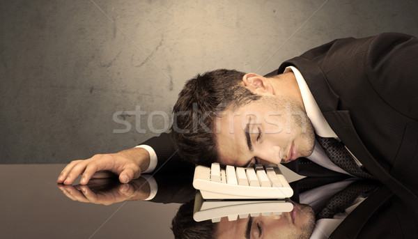 Frustrated businessman's head on keyboard Stock photo © ra2studio