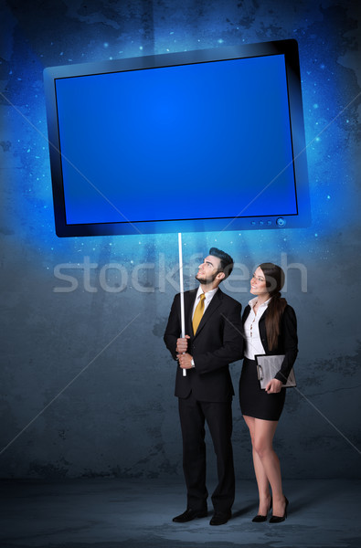 Business couple with shining tablet Stock photo © ra2studio