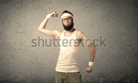 Young male showing muscles Stock photo © ra2studio