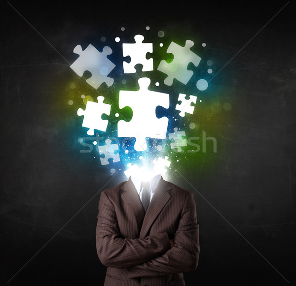 Character in suit with puzzle head concept Stock photo © ra2studio