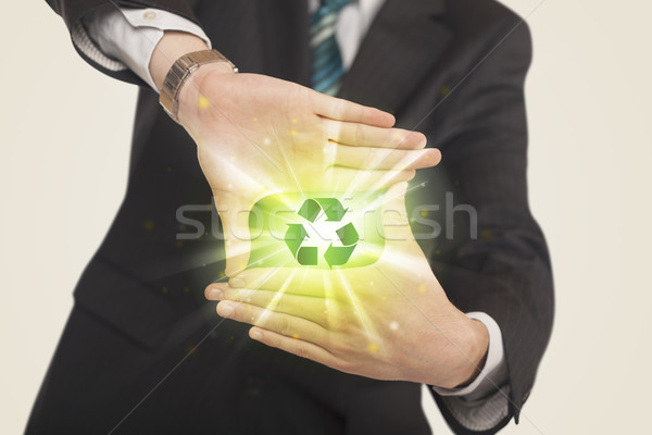 Mains forme recyclage signe vert centre [[stock_photo]] © ra2studio