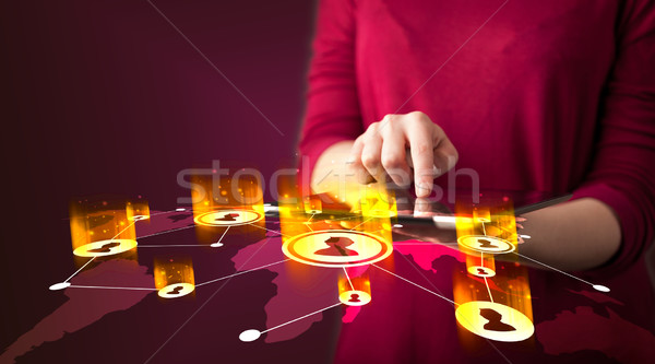 Hand holding tablet device with social network map Stock photo © ra2studio