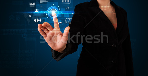 Young business woman touching future web technology buttons and  Stock photo © ra2studio