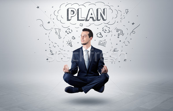 Businessman meditates with doodle concept Stock photo © ra2studio