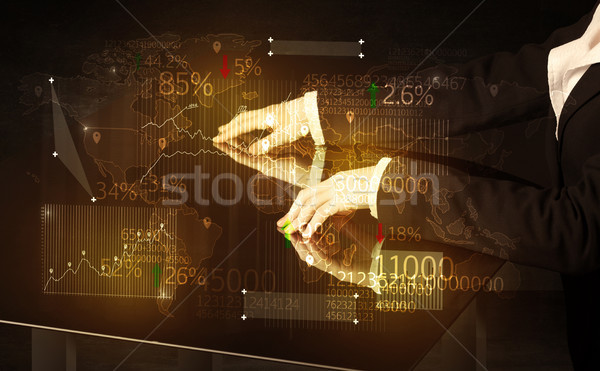 Hands navigate on high tech smart table with business icons Stock photo © ra2studio