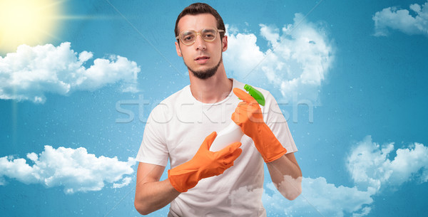 Солнечный экономка оранжевый перчатки облачный мужчины Сток-фото © ra2studio