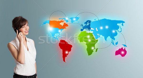 young woman making phone call with colorful world map Stock photo © ra2studio