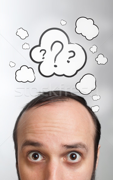 Young guy with question mark over his head Stock photo © ra2studio