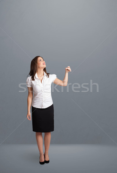 Pretty lady gesturing with copy space Stock photo © ra2studio