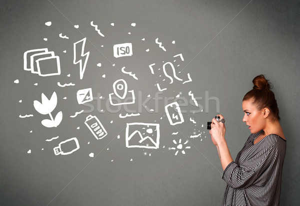 Photographer girl capturing white photography icons and symbols Stock photo © ra2studio